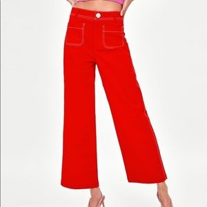 Zara red trousers with white topstitching